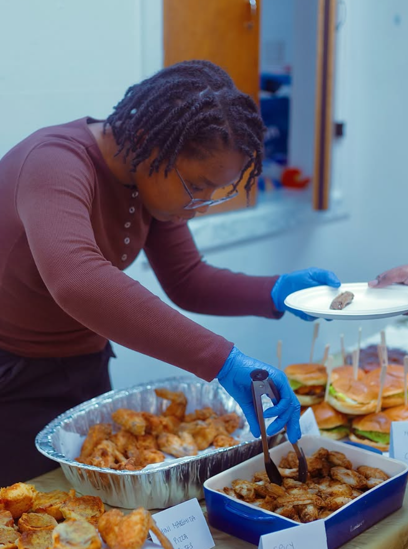 Heavenly Cuisine UK serving wings, sliders and hot food at a catered event in Manchester